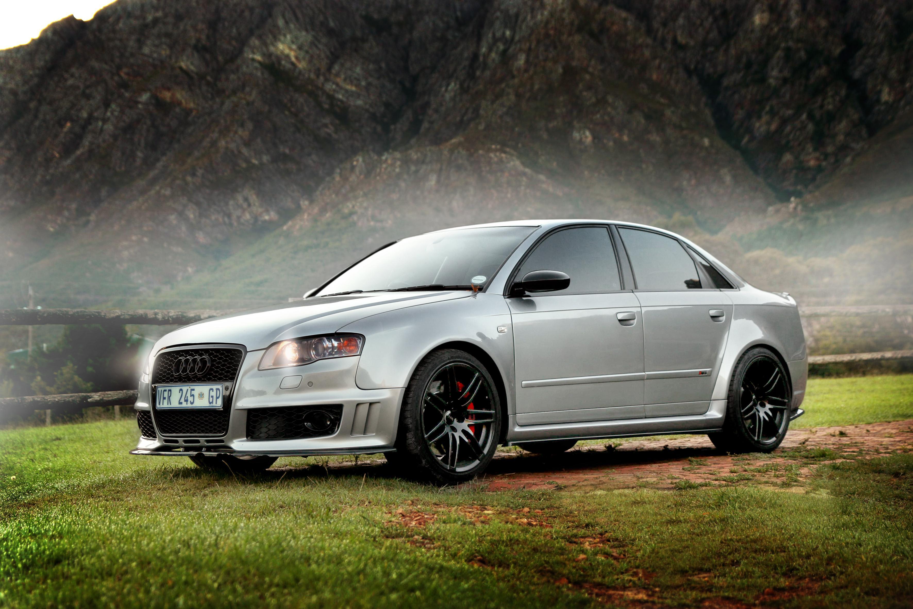 Silver Audi in a scenic mountain landscape